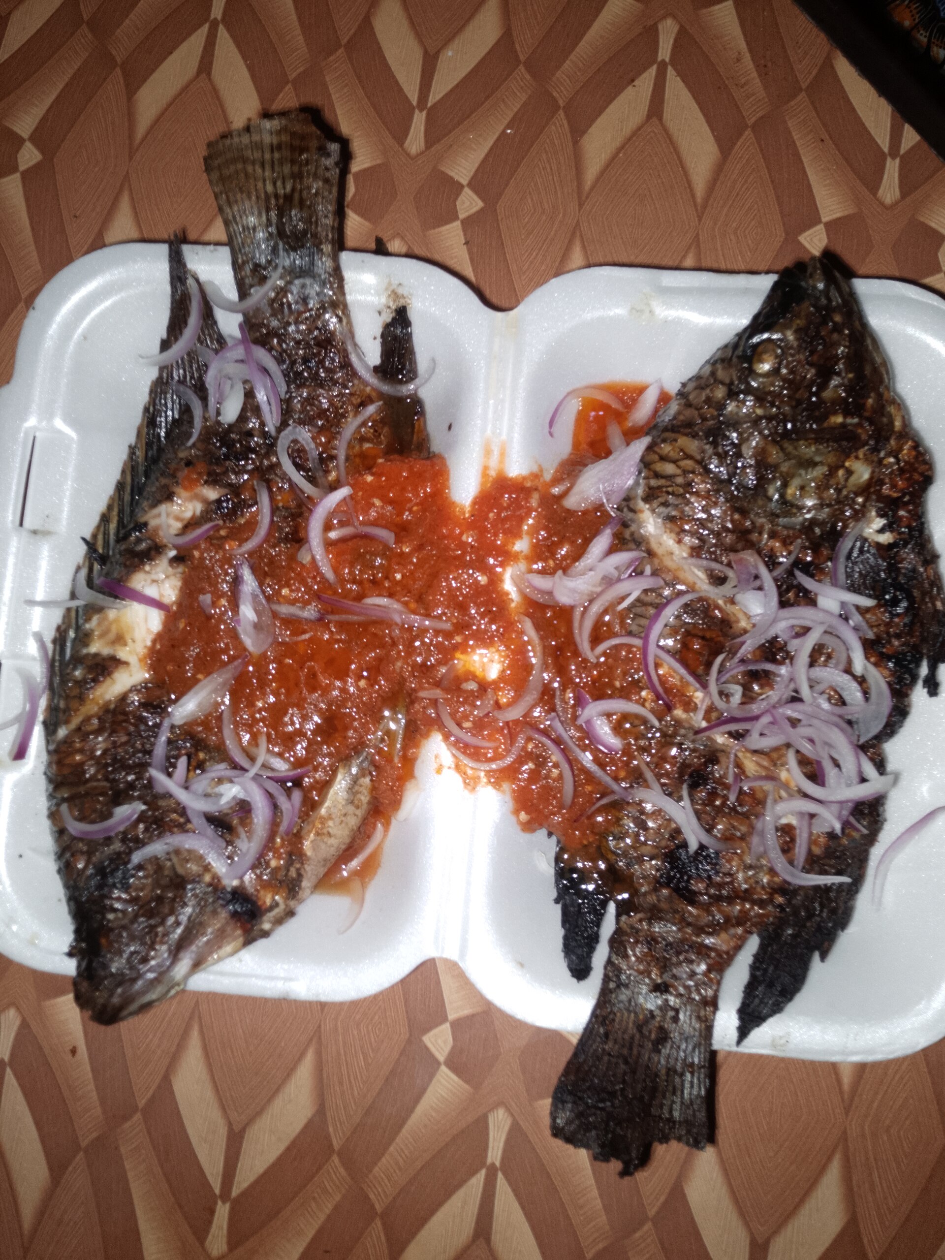 Grilled tilapia finished over heat